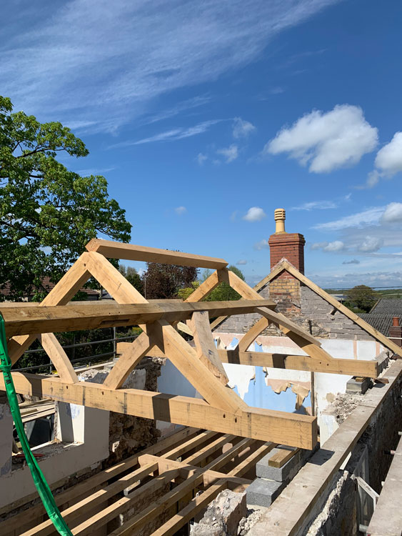 Top of Oak Framed Roof structure with clear sky