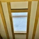 A velux window set in oak framed rafters